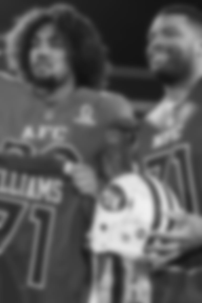 AFC defensive end Leonard Williams, left, of the New York Jets, and NFC offensive tackle Trent Williams, of the Washington Redskins exchange a helmet and jersey after the NFL Pro Bowl football game in Orlando, Fla., Sunday, Jan. 29, 2017. The AFC won 20-13. (AP Photo/Phelan M. Ebenhack)