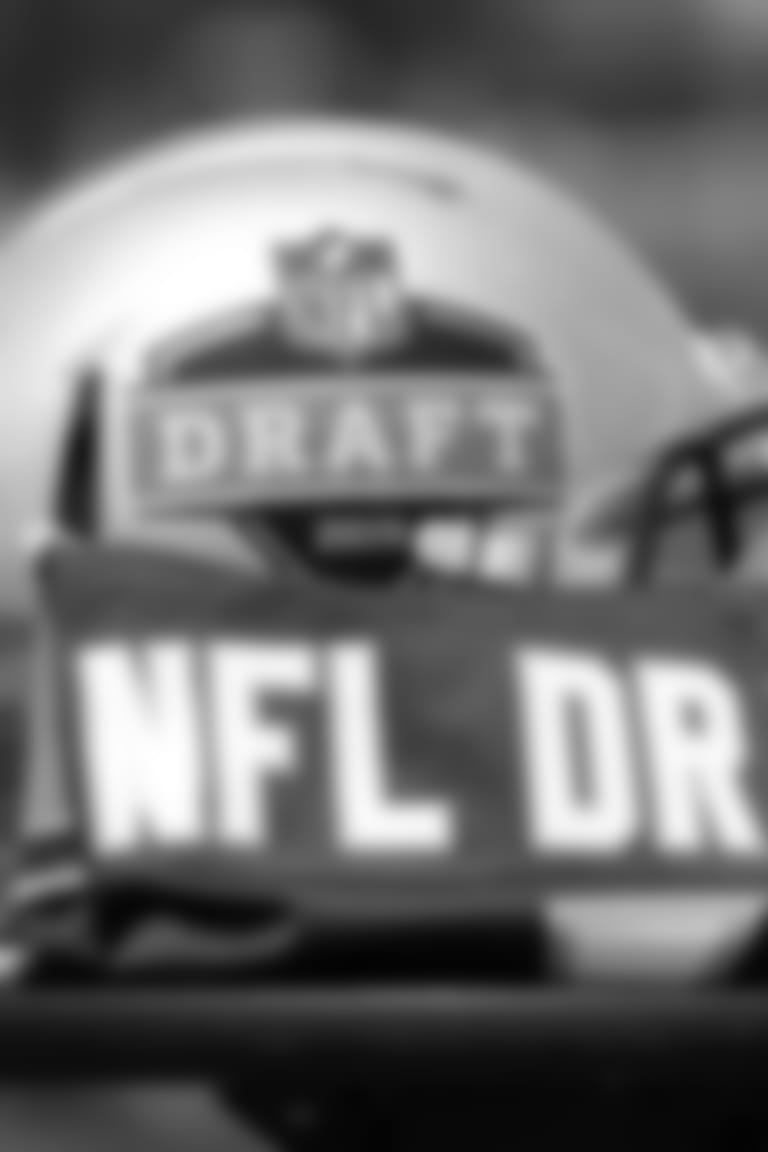 A helmet, football and jersey are displayed during a news conference concerning the 2019 NFL football draft Wednesday, May 23, 2018, in Nashville, Tenn. League owners awarded the 2019 draft to Nashville during their annual spring meetings on Wednesday, May 23, 2018, in Atlanta. (AP Photo/Mark Humphrey)