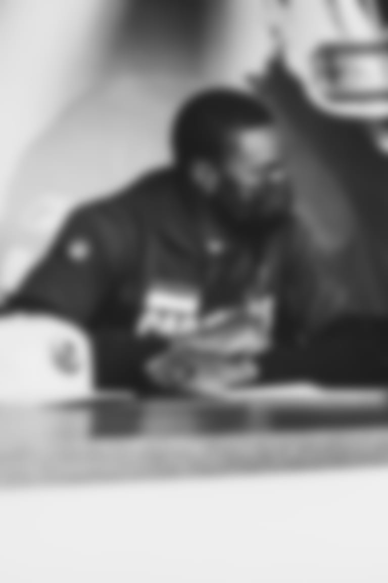 WR A.J. Green (left) signs his contract alongside owner Michael Bidwill.