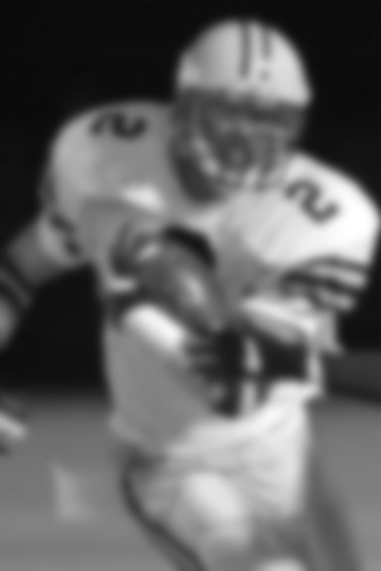 St. Ignatius High School vs. Solon High School football, Byers Field, Parma, OH  Saturday Nov. 18, 2000.  St. Ignatius receiver # 2 Jonathan Gannon pulls in a pass and picks up yardage in the first quarter. Solon's # 22 Justin Bitner tries to tackle.  (Larry Hamel-Lambert/The Plain Dealer)  DIGITAL CAMERA FILE