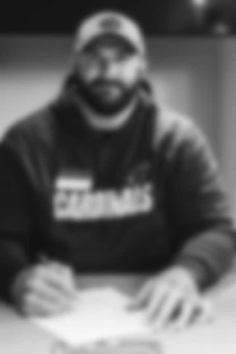 OL Brian Winters signs his contract