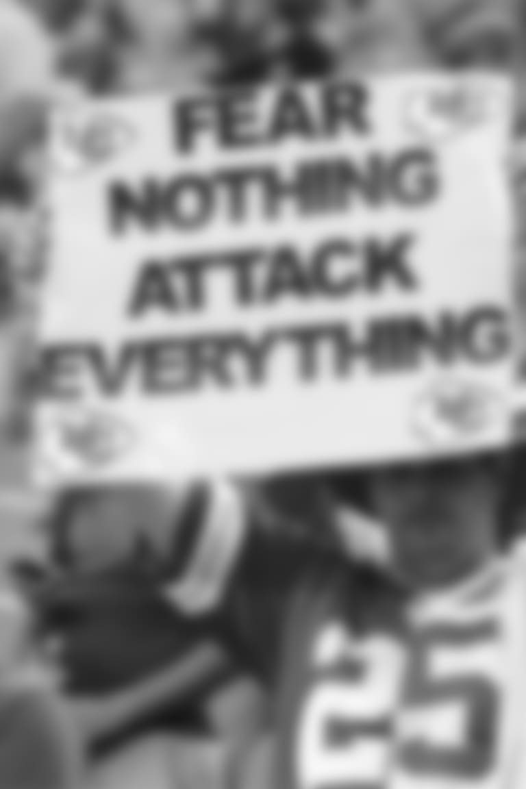 Chiefs fan holds "Fear Nothing, Attack Everything" sign