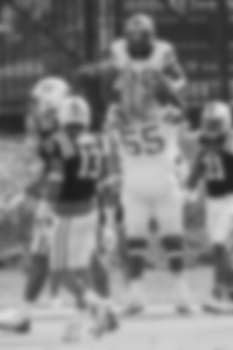 Pittsburgh's Jaryd Jones-Smith (55) lifts Darrin Hall (22) following Hall's touchdown against Duke in Durham, N.C., Saturday, Oct. 21, 2017. Pittsburgh won 24-17.