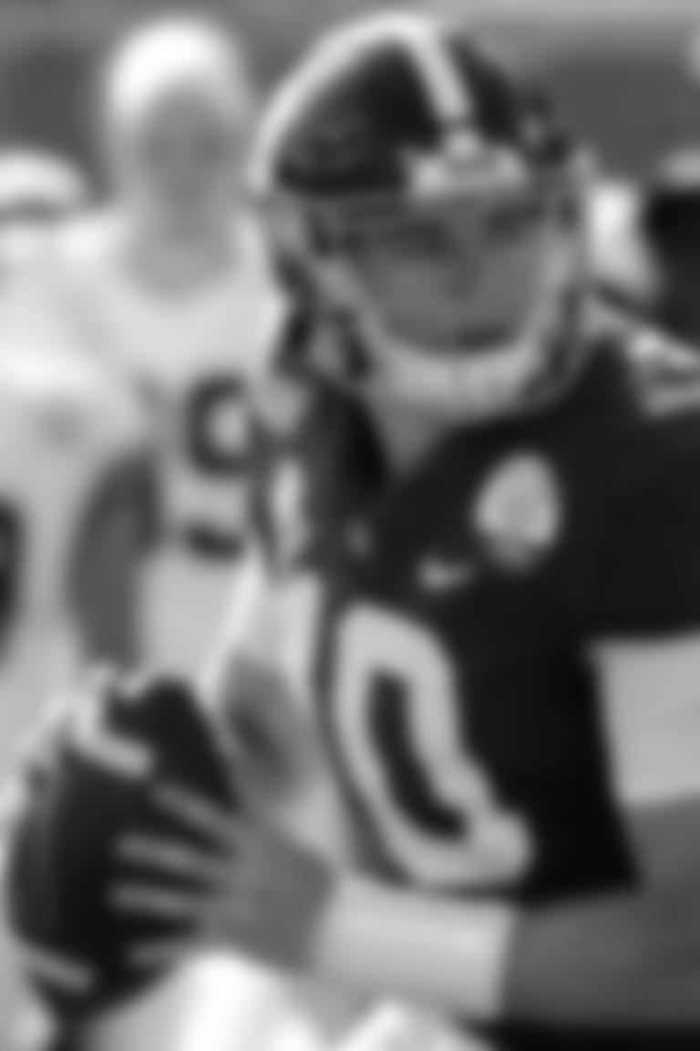 FILE - In this Jan. 1, 2020, file photo, Alabama quarterback Mac Jones (10) rolls ut as he looks for a receiver during the first half of the Citrus Bowl NCAA college football game against Michigan in Orlando, Fla.  No. 2 Alabama doesn’t look like a team that lost quarterback Tua Tagovailoa and two first-round receivers. Mac Jones still has a selection of some of the SEC’s best playmakers, including Jaylen Waddle. (AP Photo/John Raoux, File)