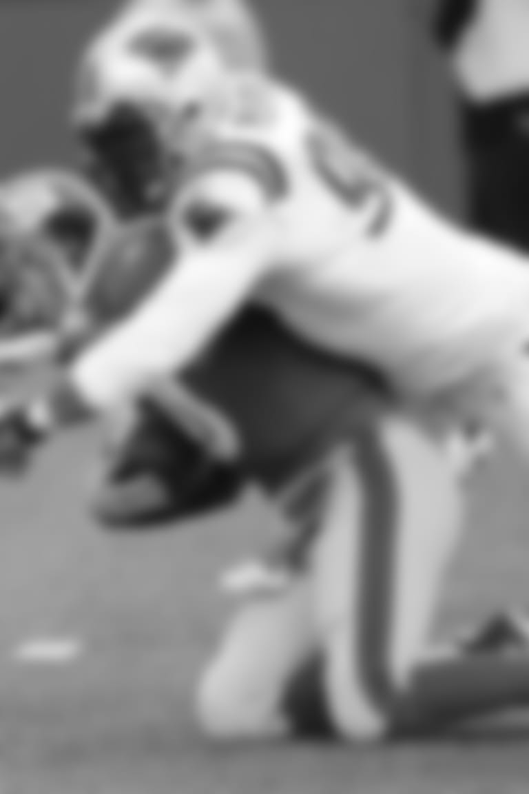 New York Giants quarterback Eli Manning (10) is sacked by Carolina Panthers' Julius Peppers (90) in the second quarter of an NFL football game Sunday, Dec. 27, 2009 in East Rutherford, N.J. (AP Photo/Bill Kostroun)