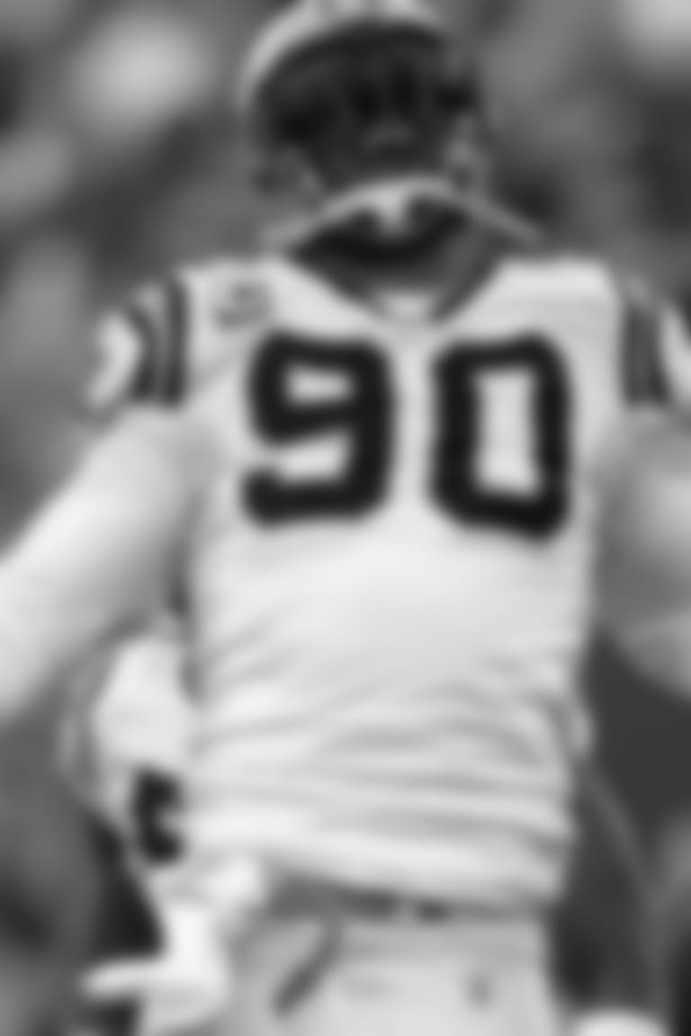 Carolina Panthers defensive end Julius Peppers (90) reacts after sacking New York Giants quarterback Eli Manning in the second quarter of an NFL football game Sunday, Dec. 27, 2009, in East Rutherford, N.J. (AP Photo/Julie Jacobson)