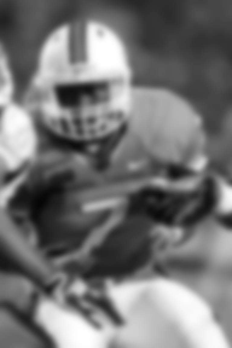 Miami running back Gus Edwards (7) runs as Savannah State linebacker Denzel Carter (53) defends during the second half of an NCAA college football game, Saturday, Sept. 21, 2013, in Miami Gardens, Fla. (AP Photo/Lynne Sladky)