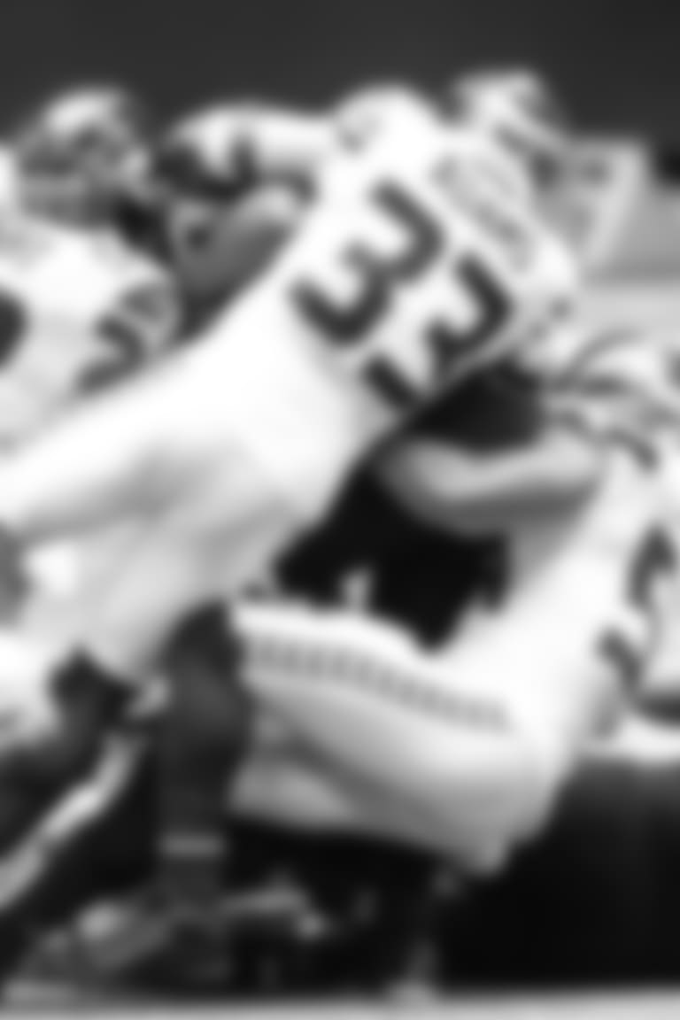 Seahawks K.J. Wright, Jamal Adams and Bobby Wagner combine on a first half tackle.