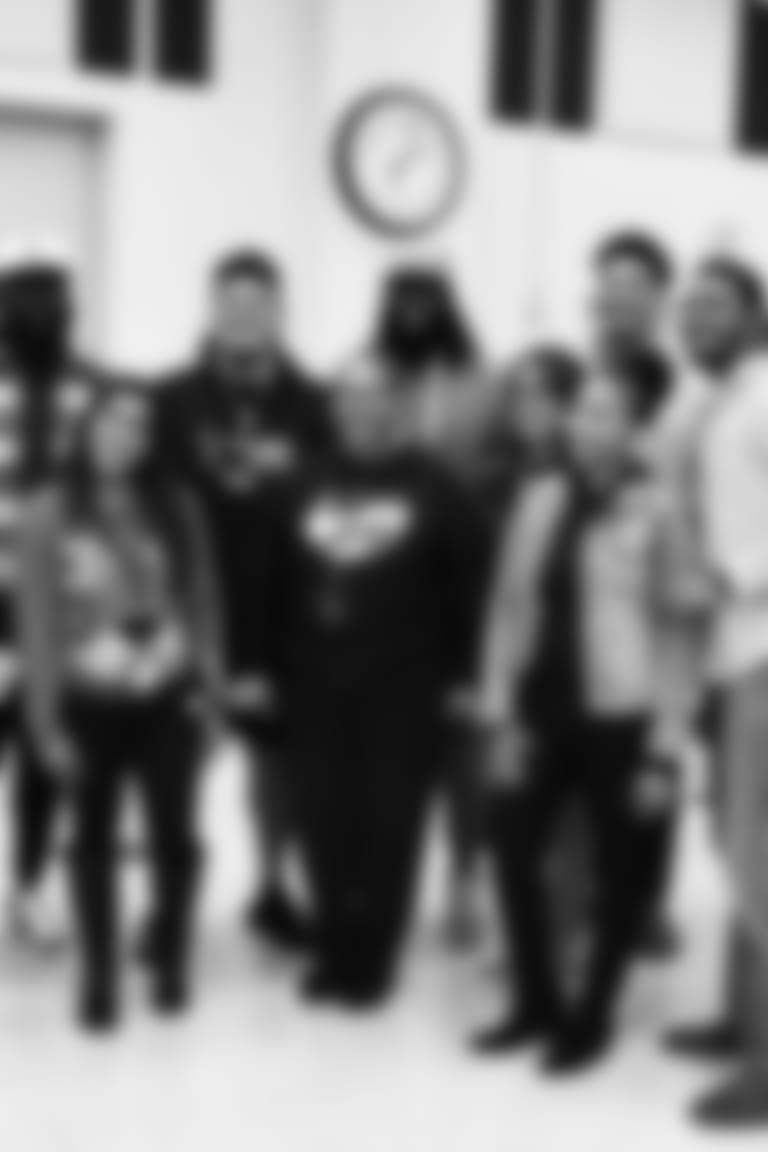 An image from the Dec. 20, 2022 community development event.  Texans defensive linemen gave holiday gifts to students at Isaacs Elementary School in Houston, TX.