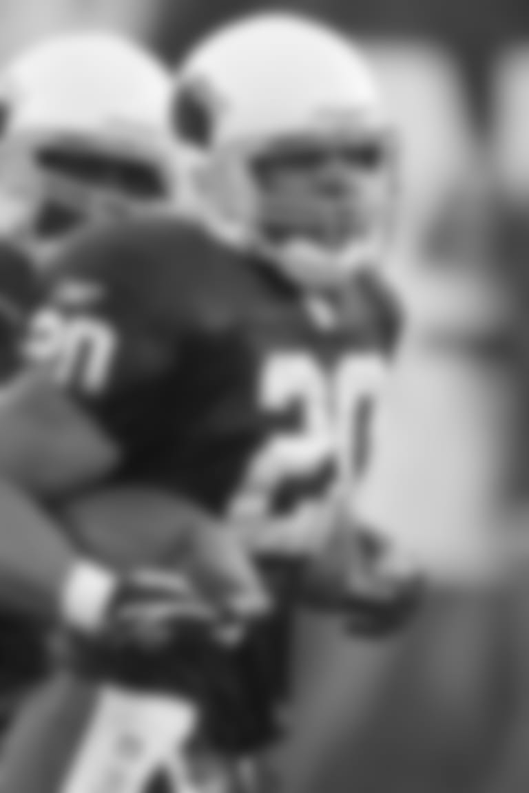 RB Damien Anderson runs off the field with the ball after recovering an onside kick against the Vikings in 2003