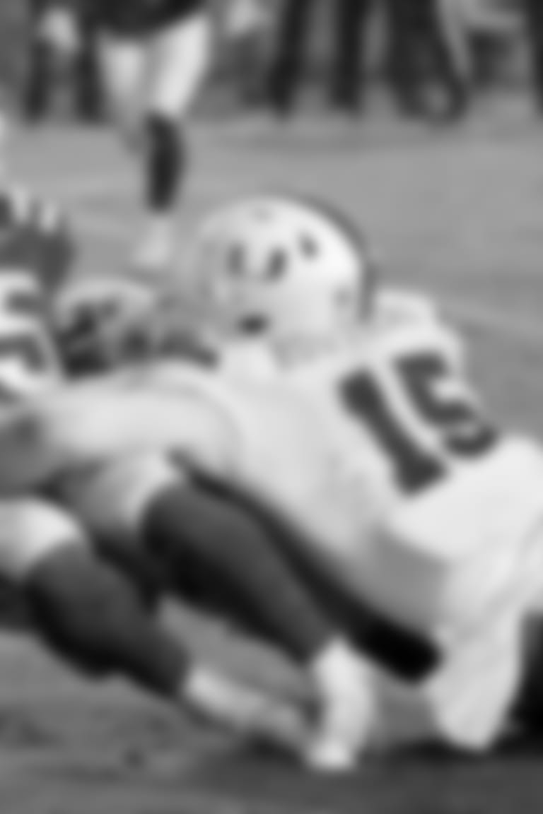 FILE - In this Nov. 30, 2019, file photo, Miami's Gregory Rousseau (15) tackles Duke's Deon Jackson (25) during the second half of an NCAA college football game between Miami and Duke in Durham, N.C. Rousseau was selected to The Associated Press preseason All-America first-team, Tuesday, Aug. 25, 2020. (AP Photo/Chris Seward, File)