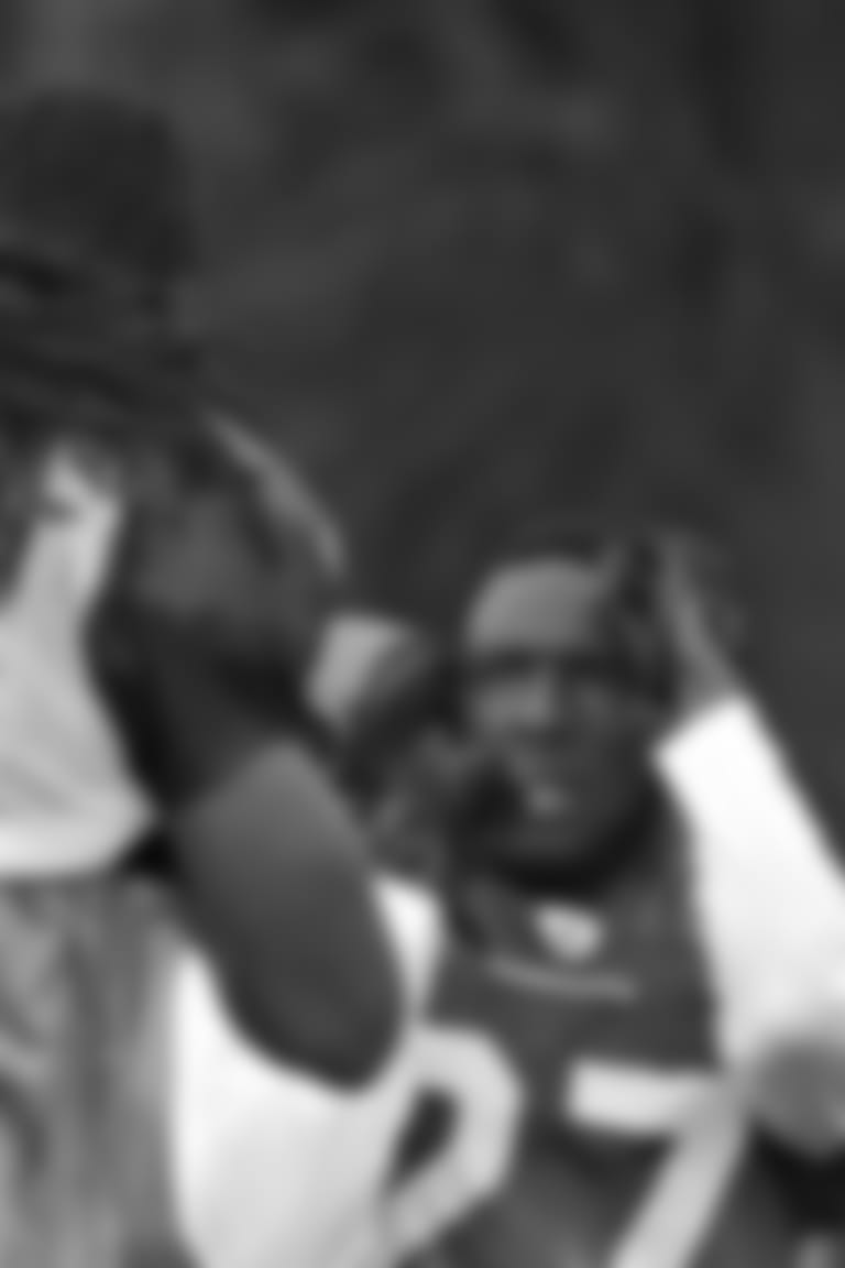 Arizona Cardinals' Michael Adams (27) and Larry Fitzgerald (11) square off during NFL football training camp Tuesday, Aug. 3, 2010, in Flagstaff, Ariz. (AP Photo/Matt York)