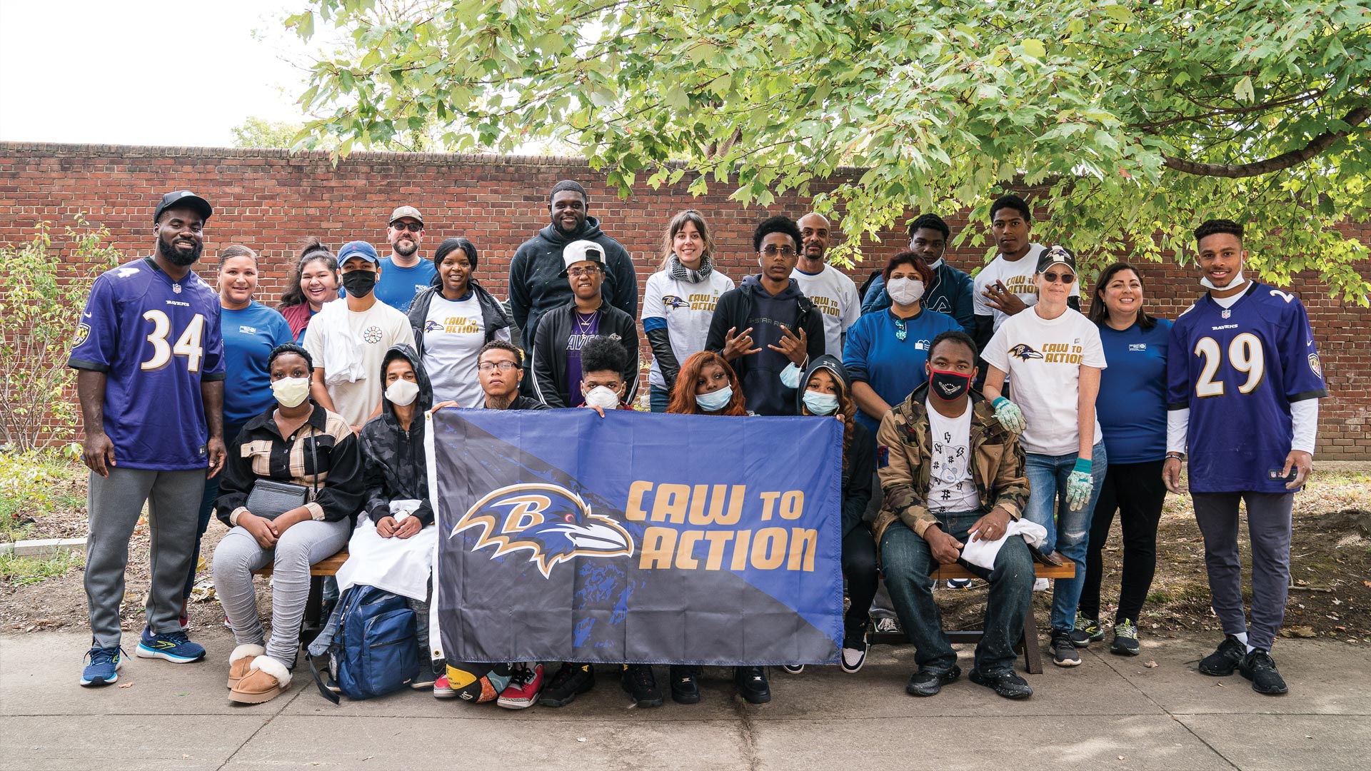 Ravens players team up with the community for Ravens Caw To Action.
