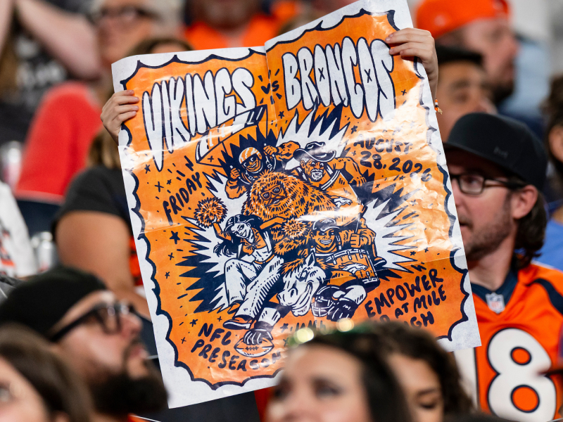 The Broncos gameday program and poster