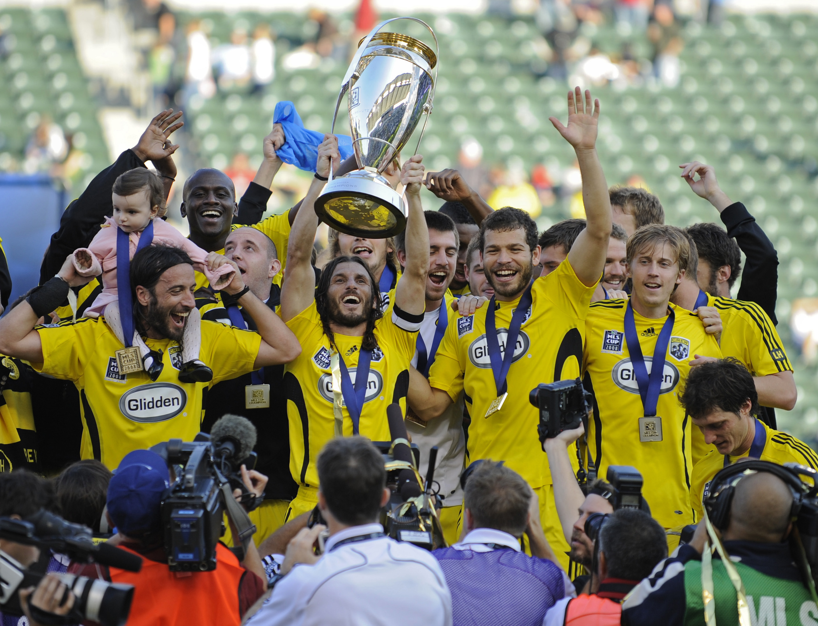 Columbus Crew defender Frankie Hejduk (2) holds the trophy as he and the rest of the team celebrate their 3-1 victory over the New York Red Bulls in the MLS Cup soccer match Sunday, Nov. 23, 2008 in Carson, Calif. (AP Photo/Gus Ruelas)