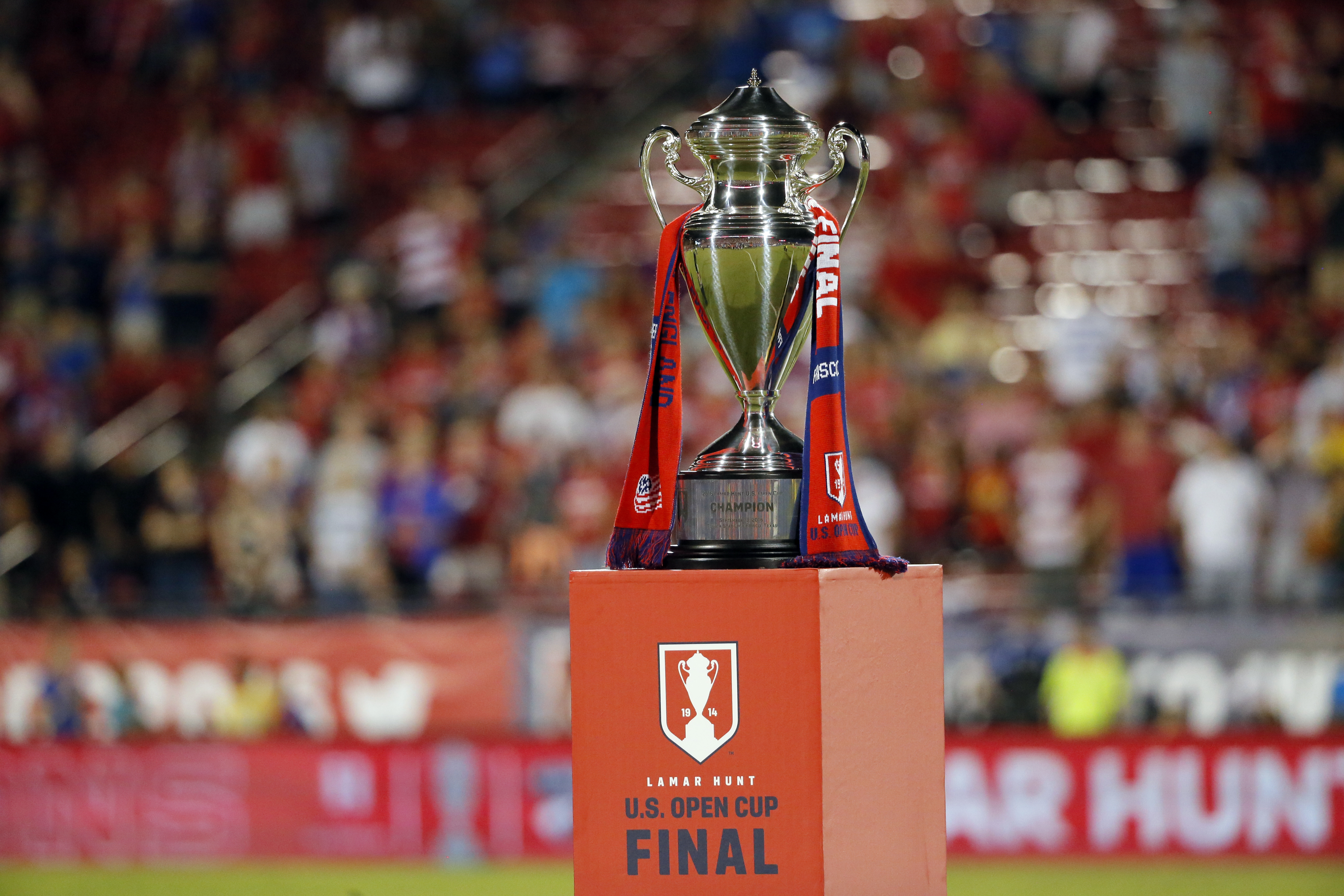 The Lamar Hunt U.S. Open Cup soccer final trophy sits on a stage at midfield after a FC Dallas, New England Revolution match, Tuesday, Sept. 13, 2016, in Frisco, Texas. (AP Photo/Tony Gutierrez)
