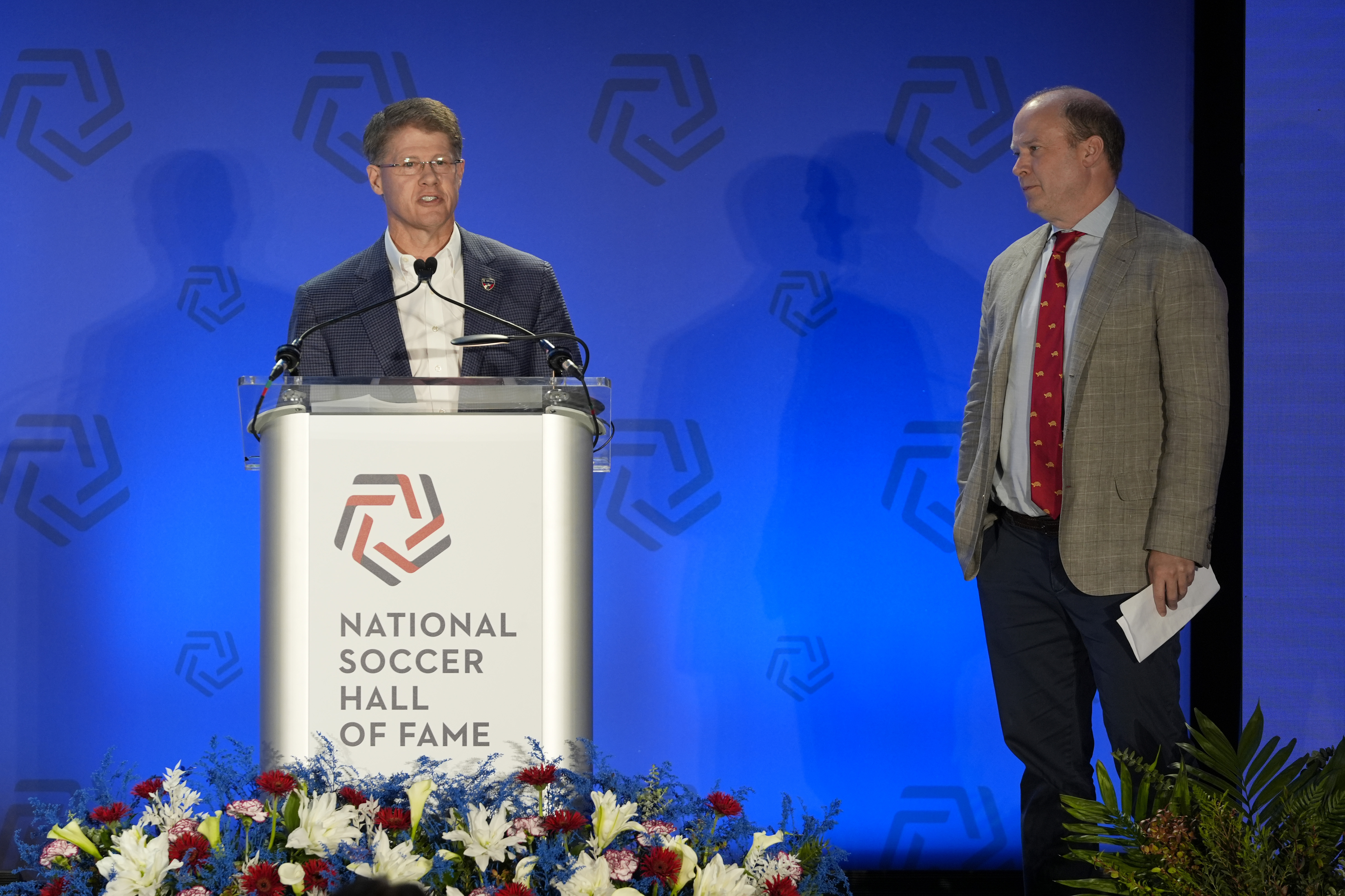 FC Dallas chairman and CEO Clark Hunt, left, speaks as Dan Hunt, president, FC Dallas, looks on during an induction ceremony for the National Soccer Hall of Fame, Saturday, May 4, 2024, in Frisco, Texas. (AP Photo/Tony Gutierrez)