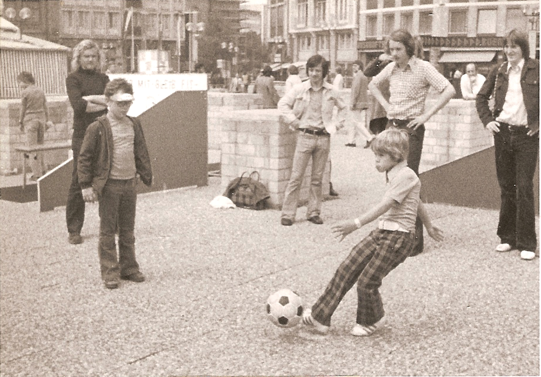 Young Clark Hunt kicking a soccer ball