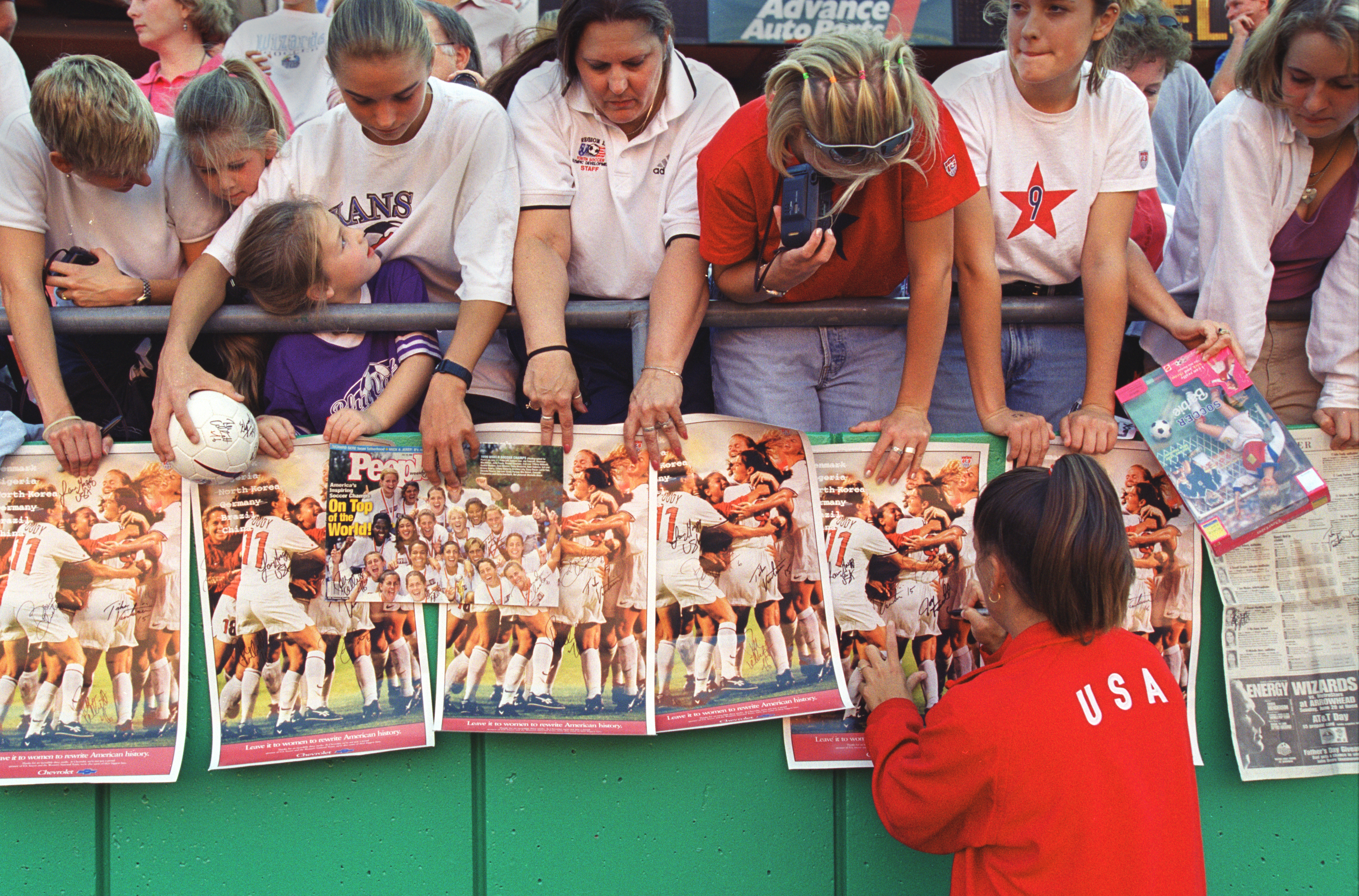 A U.S. Women's National Team player signs autographs