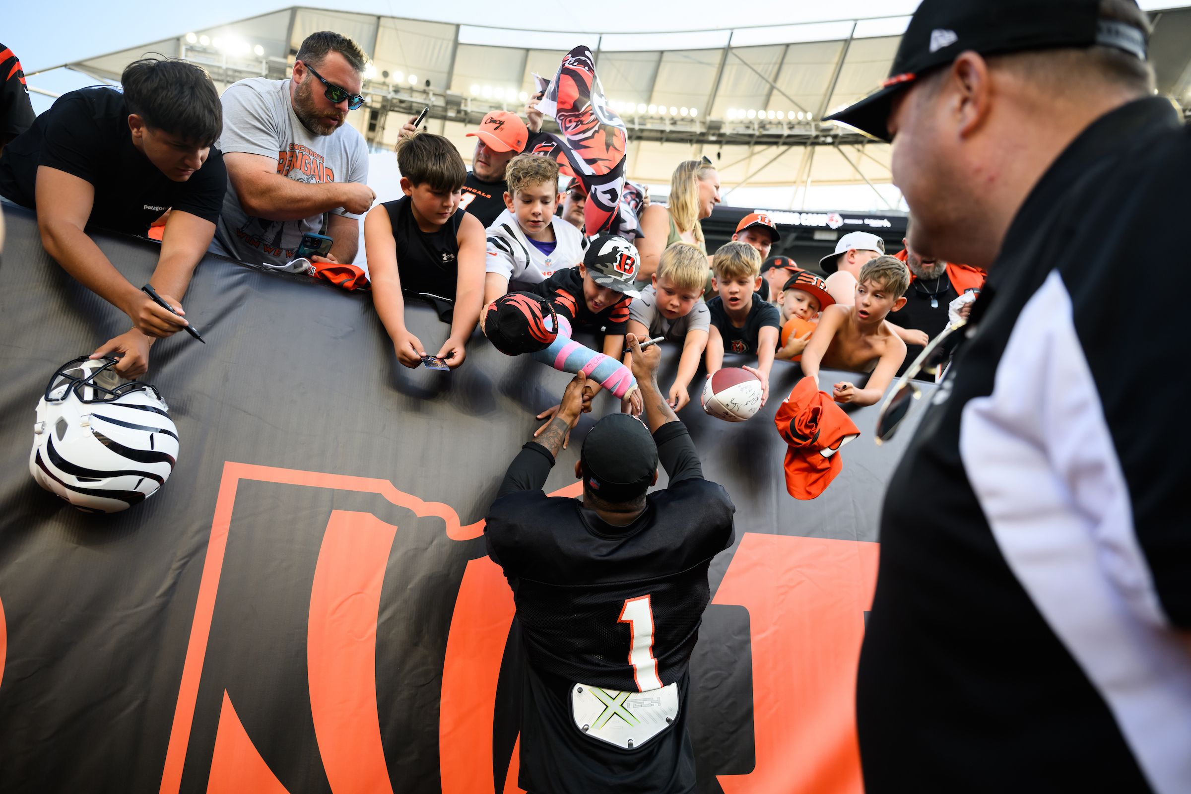 WR Ja'Marr Chase signs autographs for fans during the Bengals' Saturday Night Stadium Practice at Paycor Stadium, Saturday, Aug. 2, 2025.