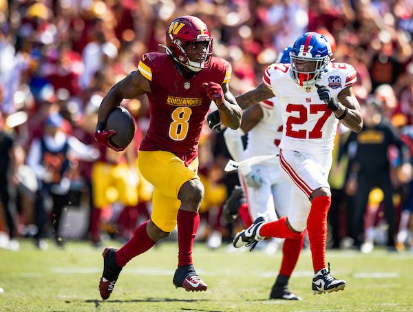 Running back Brian Robinson Jr. (8) with the carry at the New York Giants vs Washington Commanders game at Northwest Stadium in Landover MD on September 15th , 2024. (Alyssa Howell/Washington Commanders)