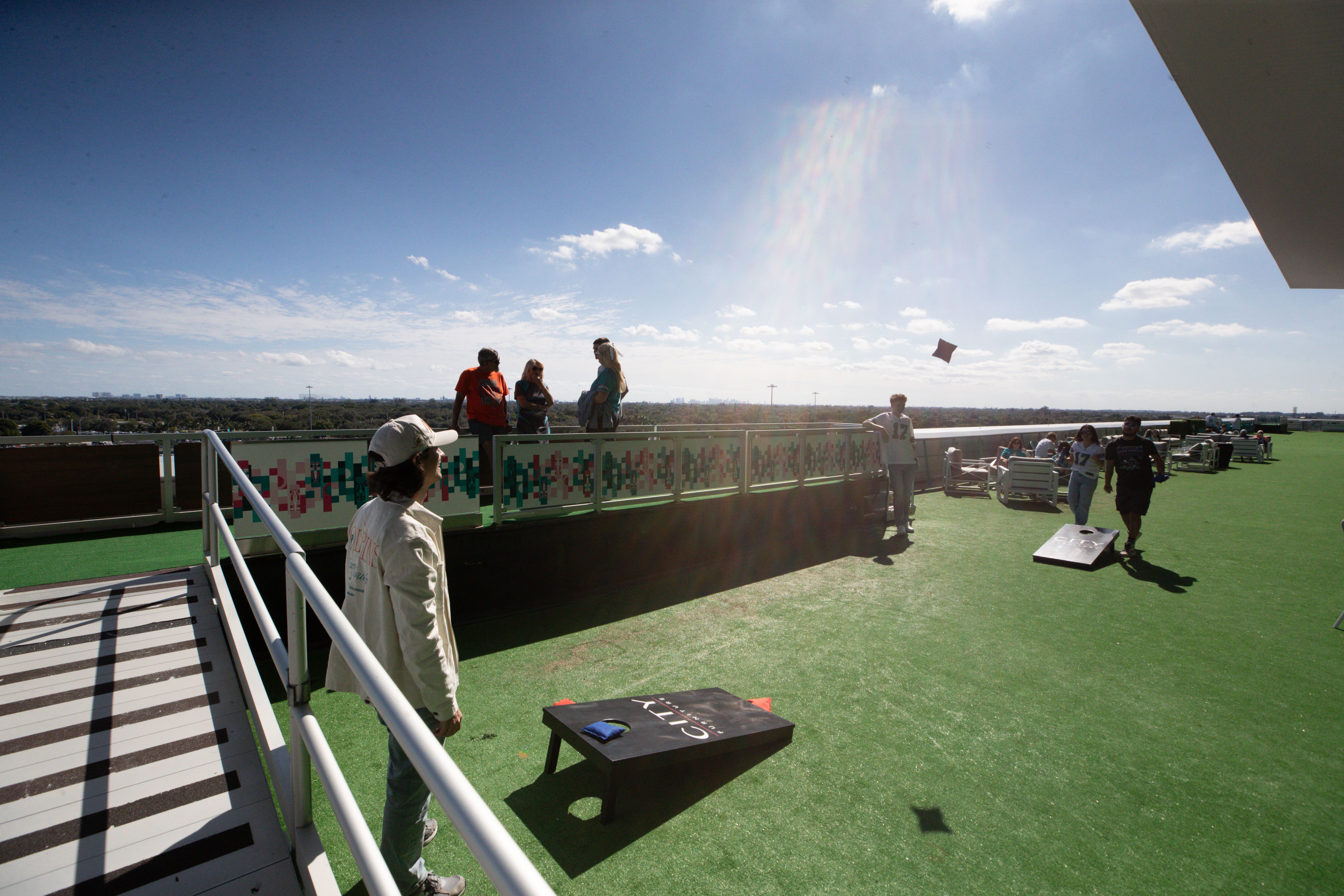 Fans enjoy the City Furniture Terrace before an NFL football game against the New England Patriots, Sunday, Nov. 24, 2024, in Miami Gardens, Fla. (Mary Holt/Miami Dolphins)