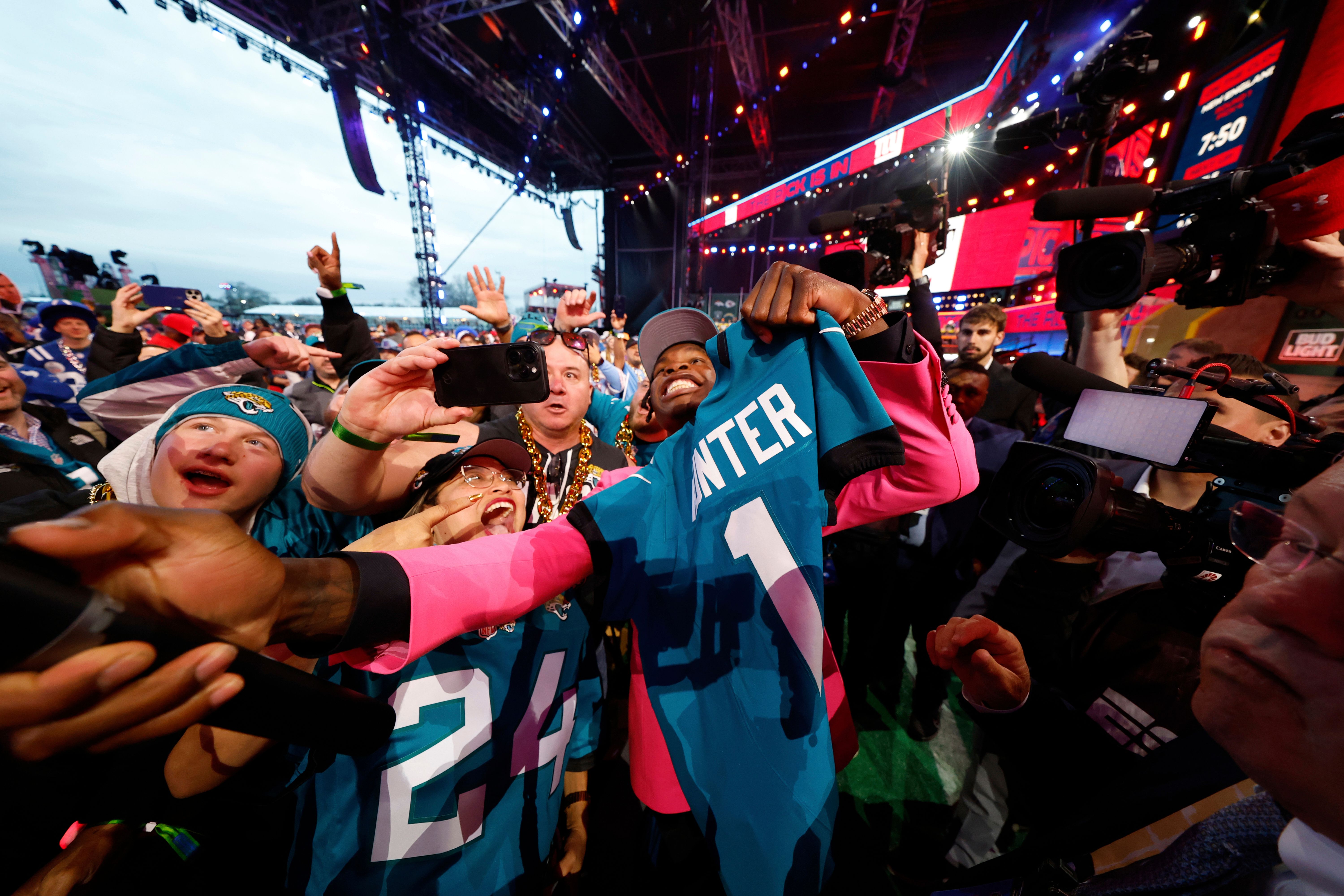 Colorado wide receiver Travis Hunter celebrates with fans after being chosen by the Jacksonville Jaguars with the second overall pick during the first round of the NFL football draft, Thursday, April 24, 2025, in Green Bay, Wis. (Tyler Kaufman/AP Content Services for the NFL)