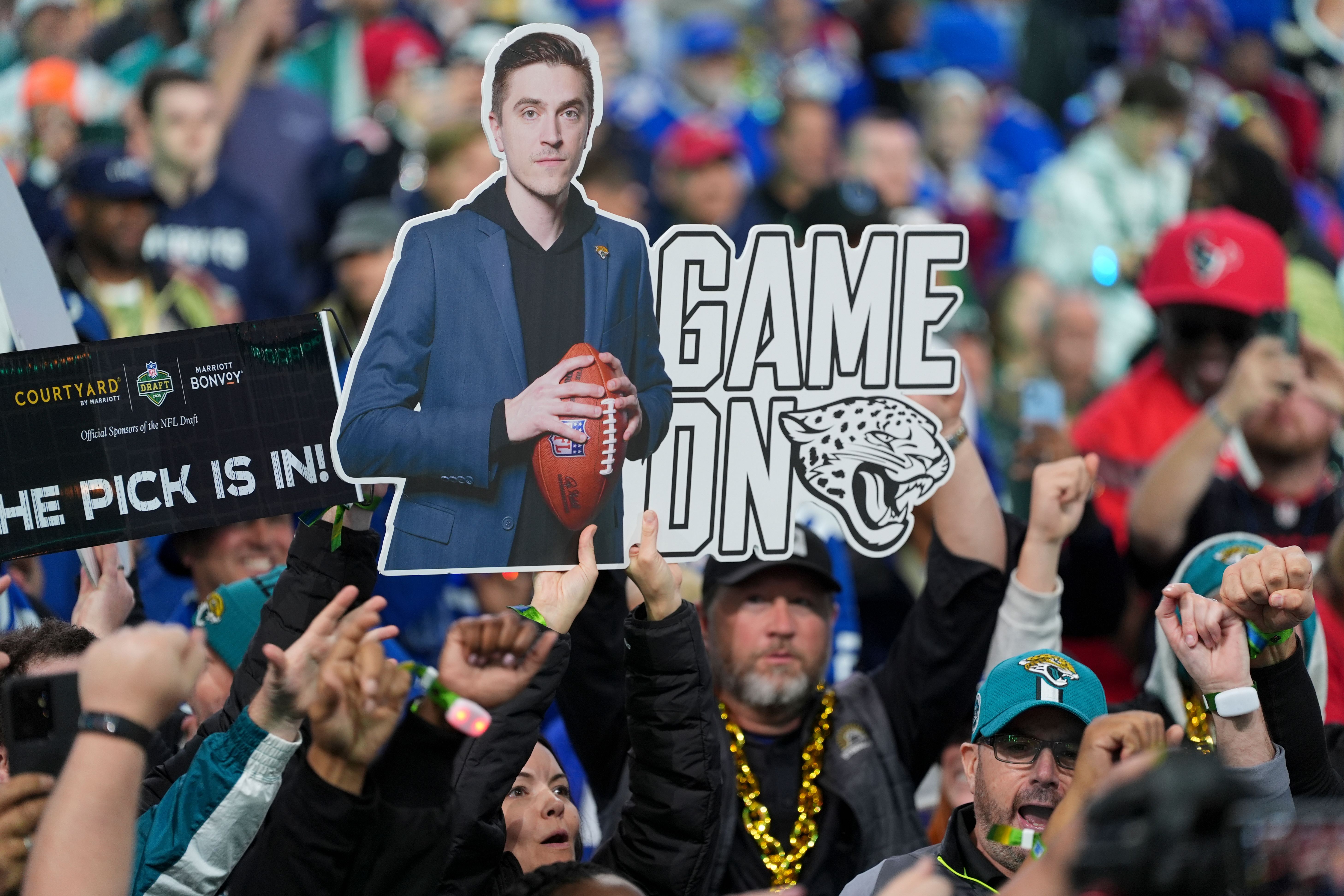 Jacksonville Jaguars fans cheer during the first round of the NFL football draft, Thursday, April 24, 2025, in Green Bay, Wis. (Ben Liebenberg via AP)
