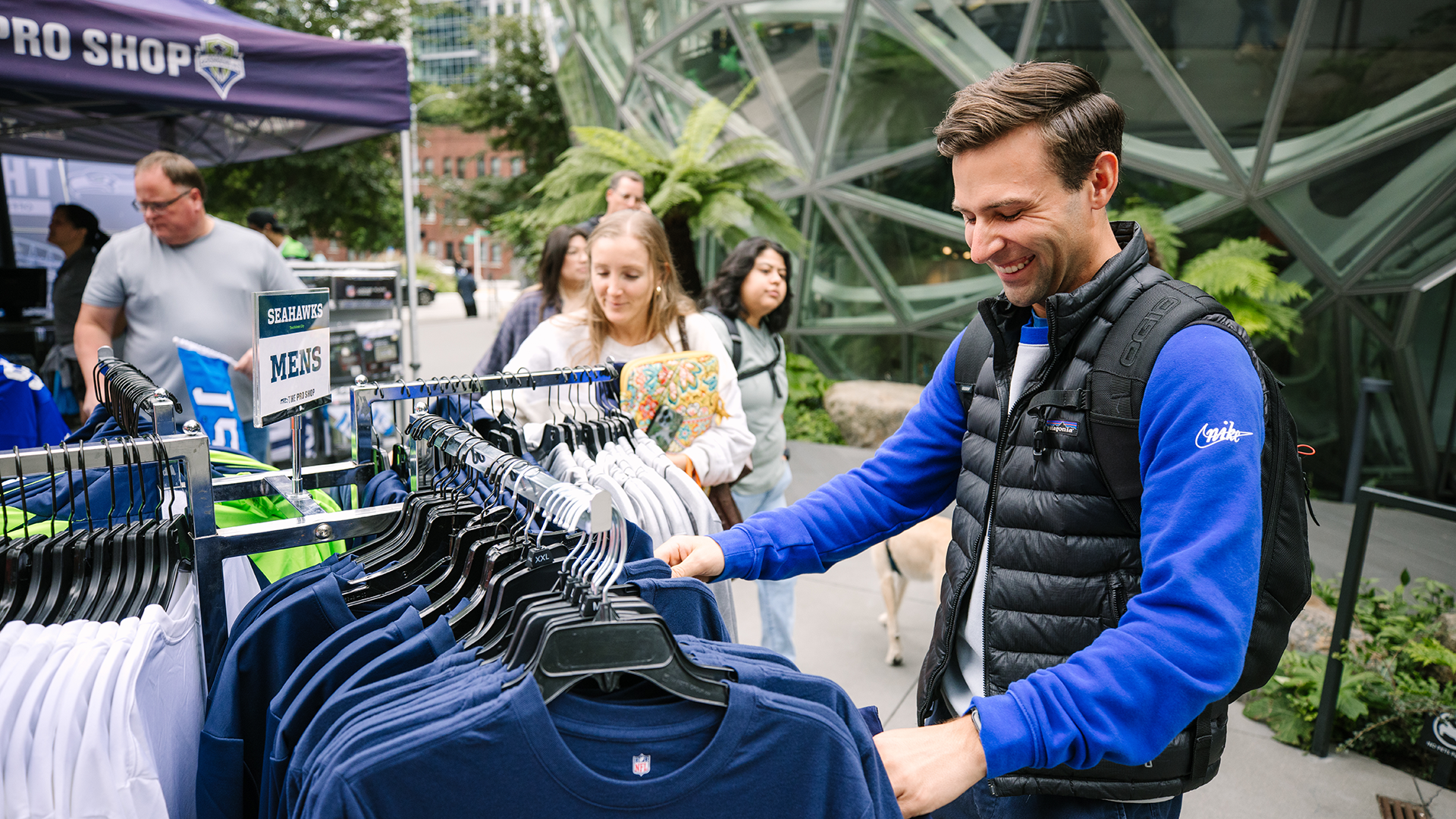 Fans browsing at the Seahawks Block Party Pro Shop popup