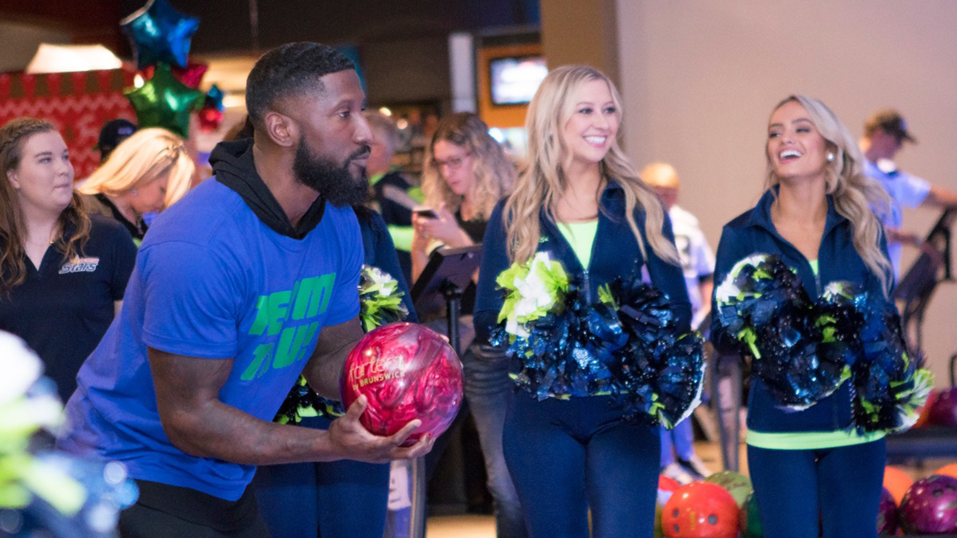 Marcus Trufant bowling at a Trufant Family Foundation event