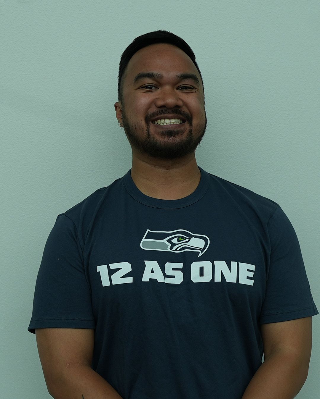 A headshot of Yanni Napat