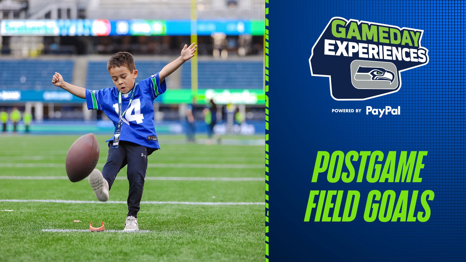 A boy kicking a football on the field