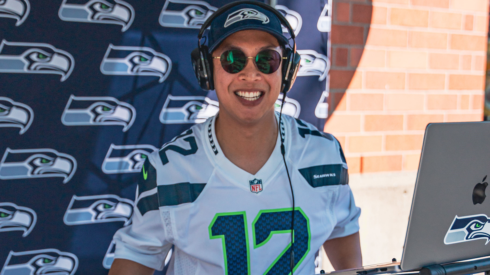 DJ Clinton playing music for the 12s