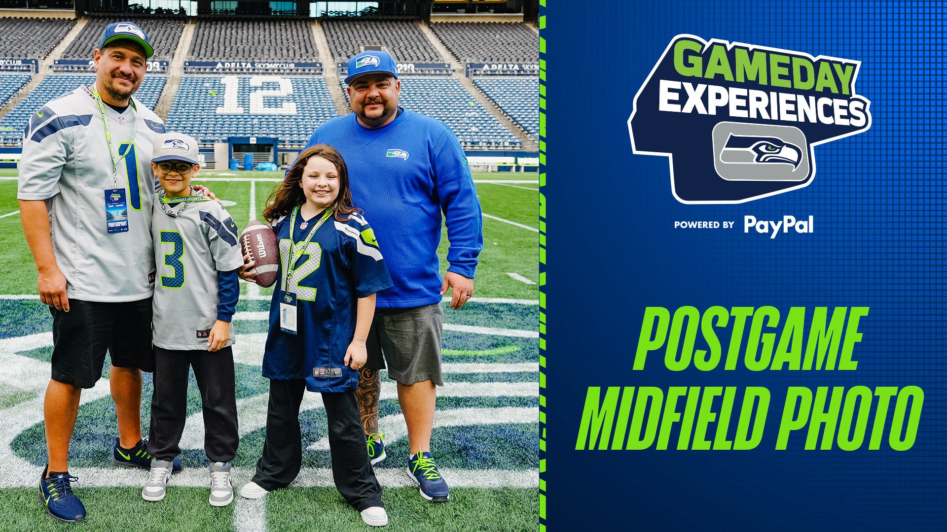 A group of fans posing for a photo on the field