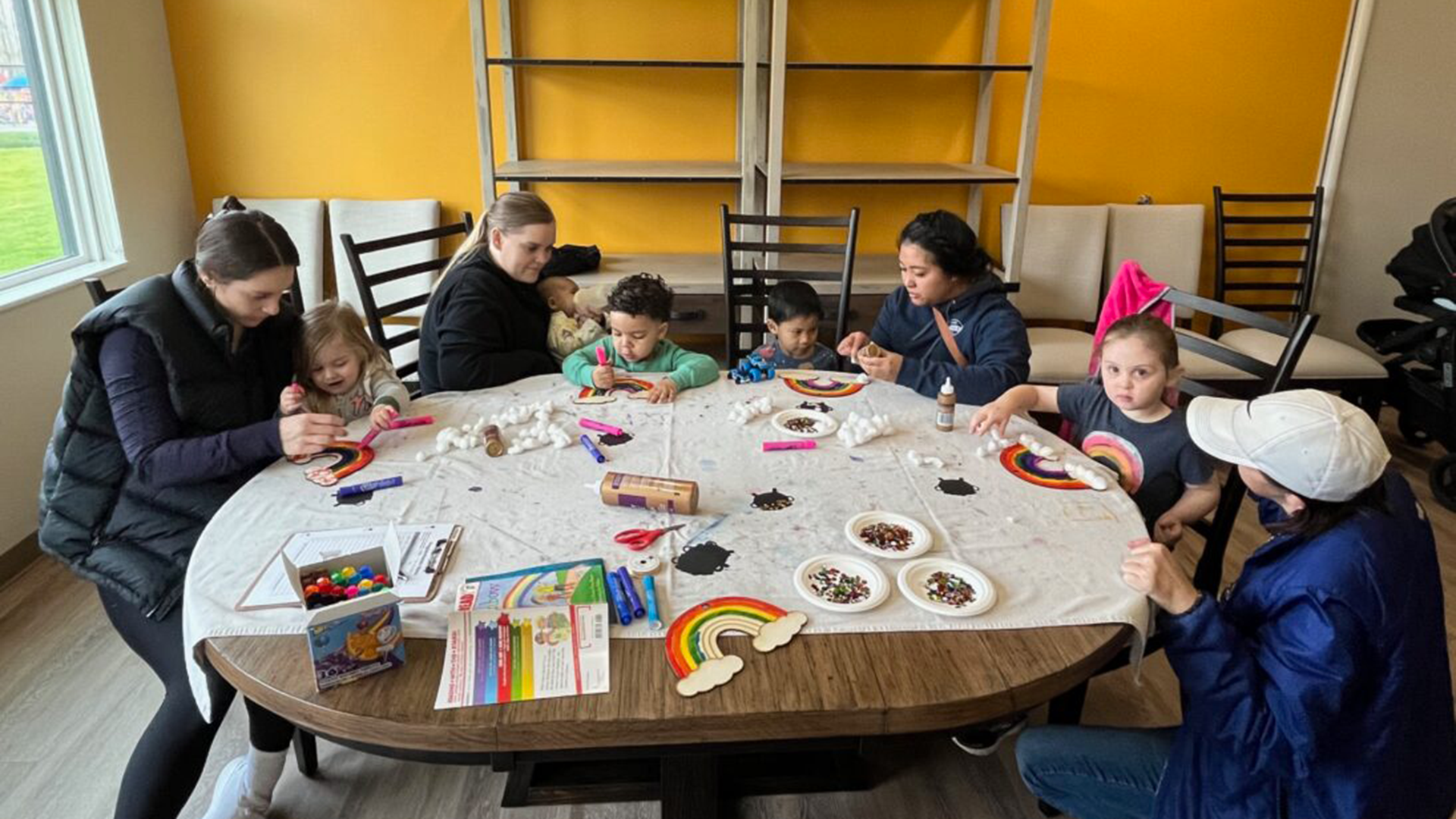 Children painting in the Family First Community Center