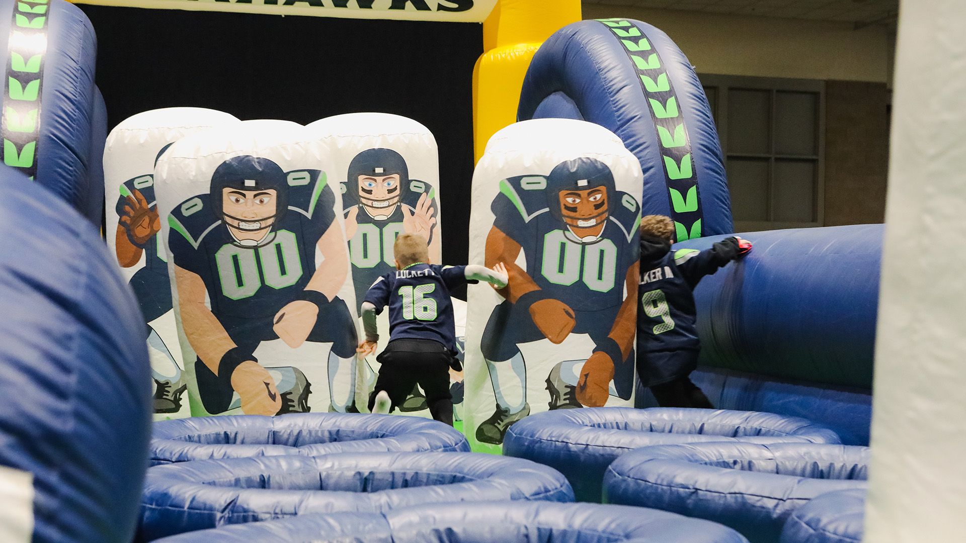 Kids playing on an inflatable in Touchdown City