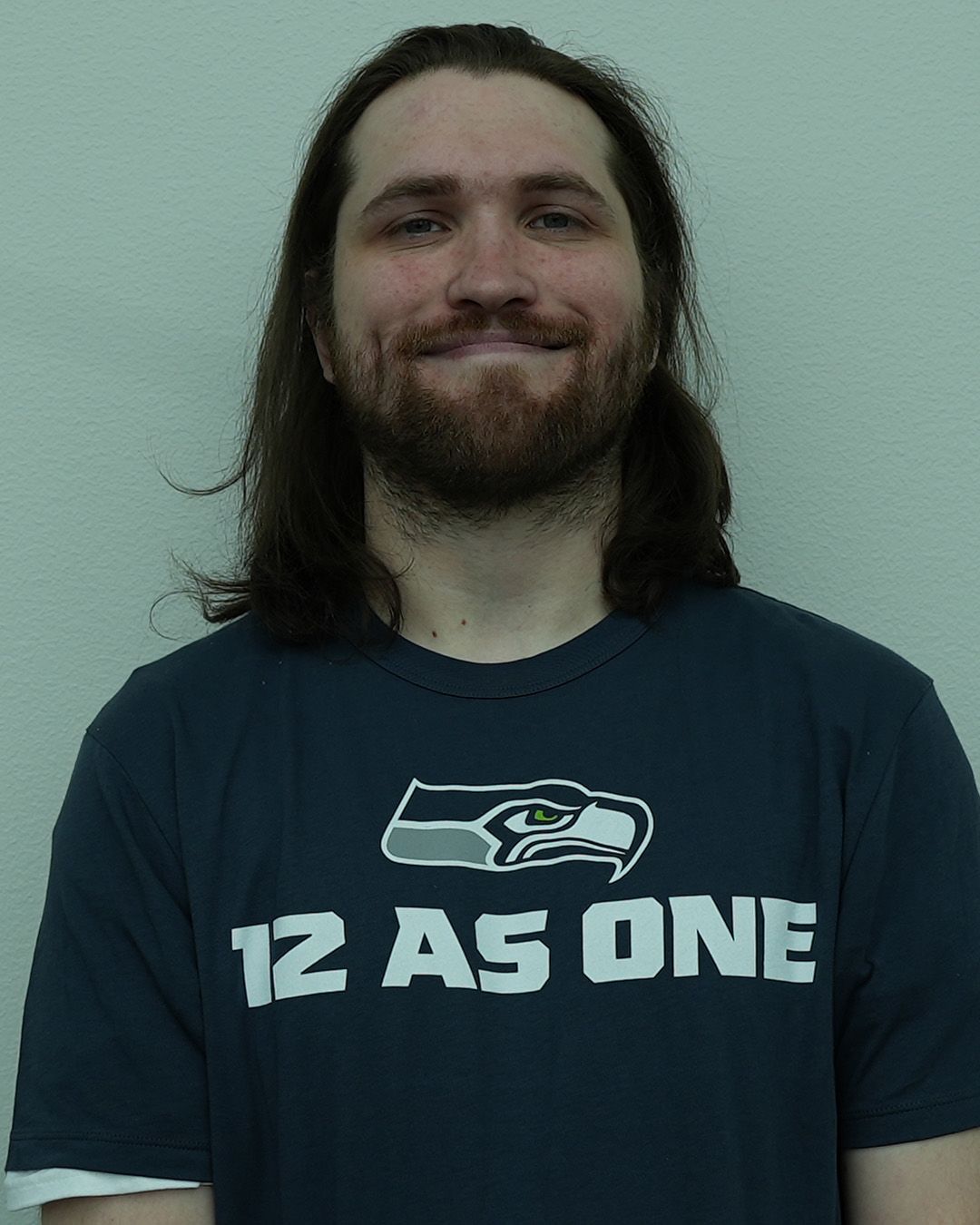 A headshot of Adam Robinson