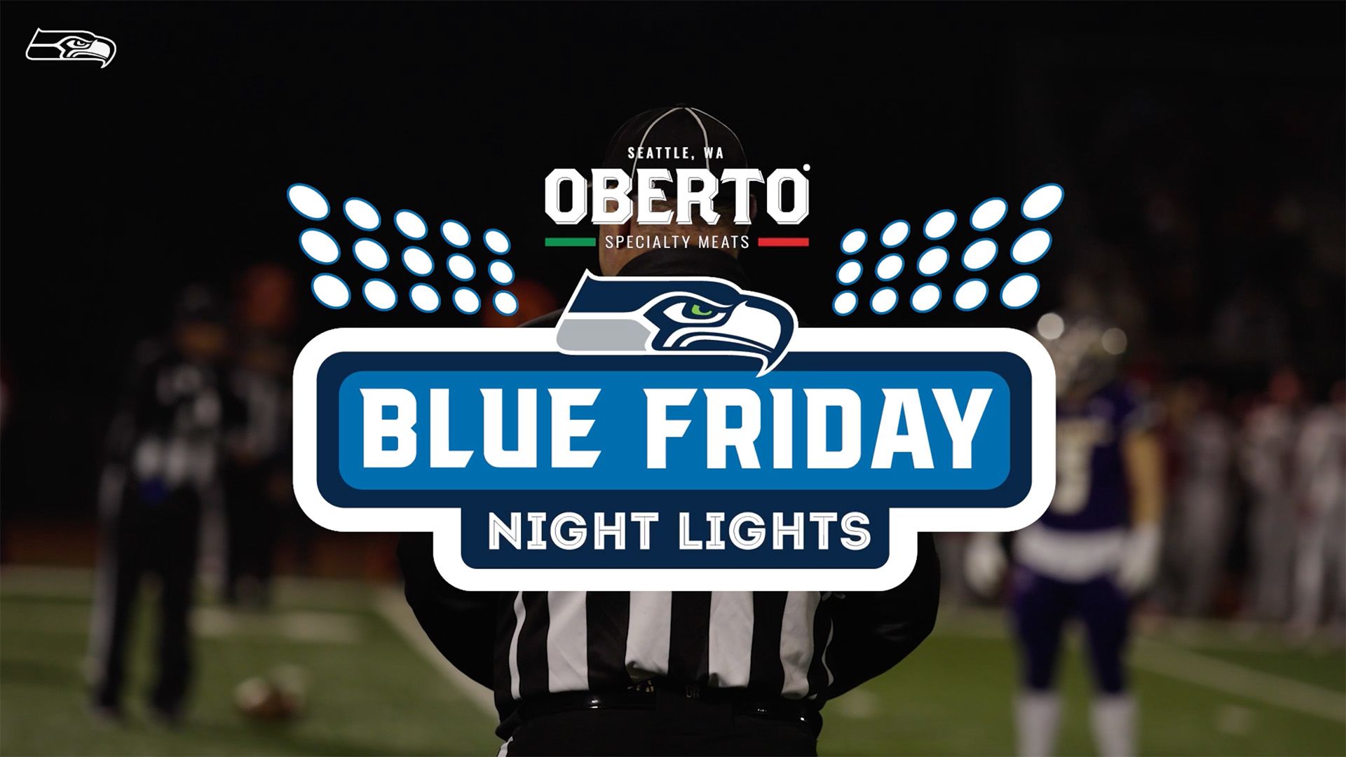 Football players running onto the field