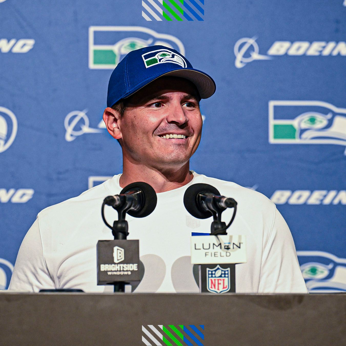 Mike Macdonald at the press conference podium