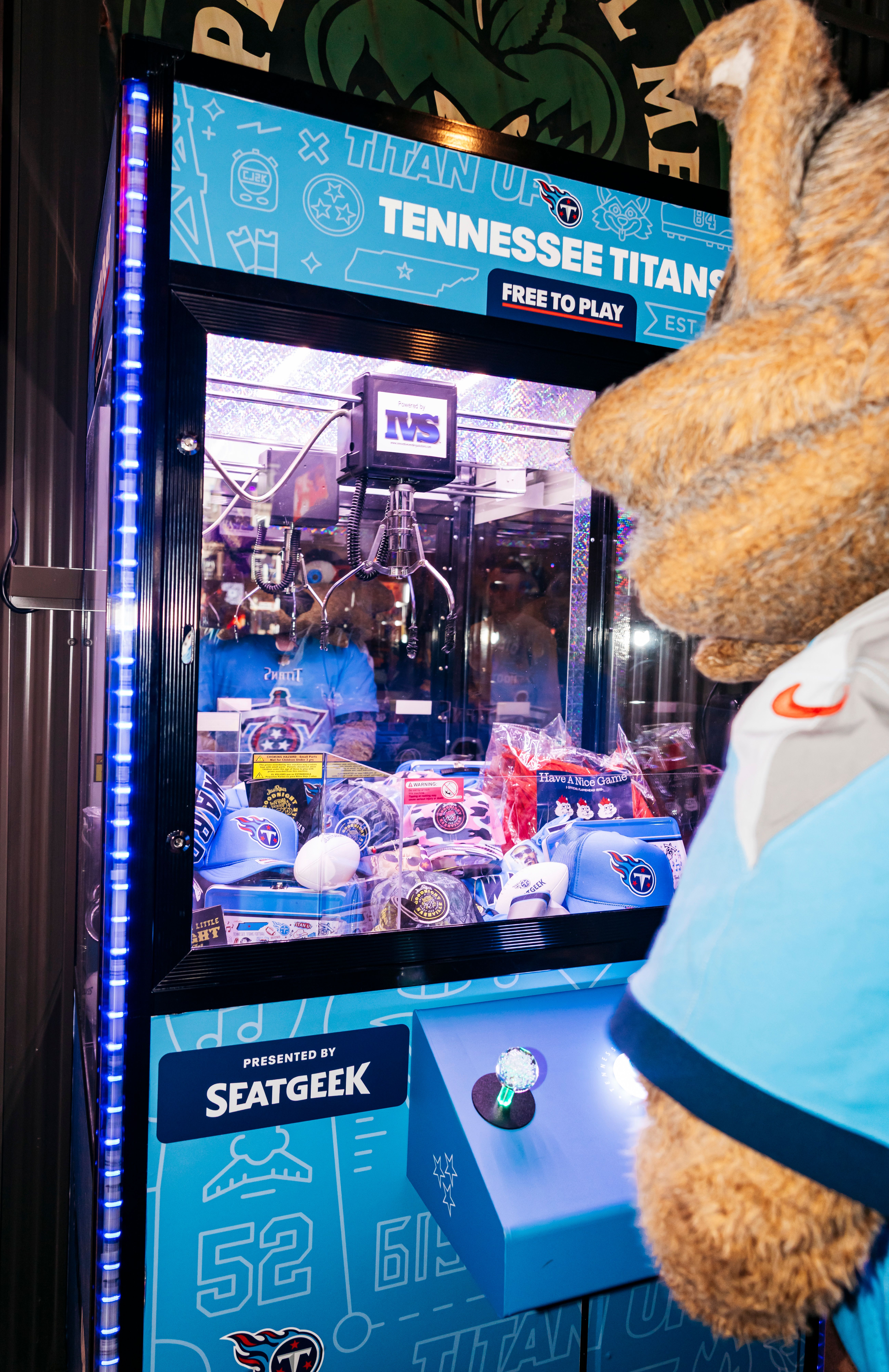 Tennessee Titans install a claw machine with various team merchandise for fans at Jelly Roll's Goodnight Nashville bar on May 07, 2025 in Nashville, TN. Photo By Connor Morss/Tennessee Titans