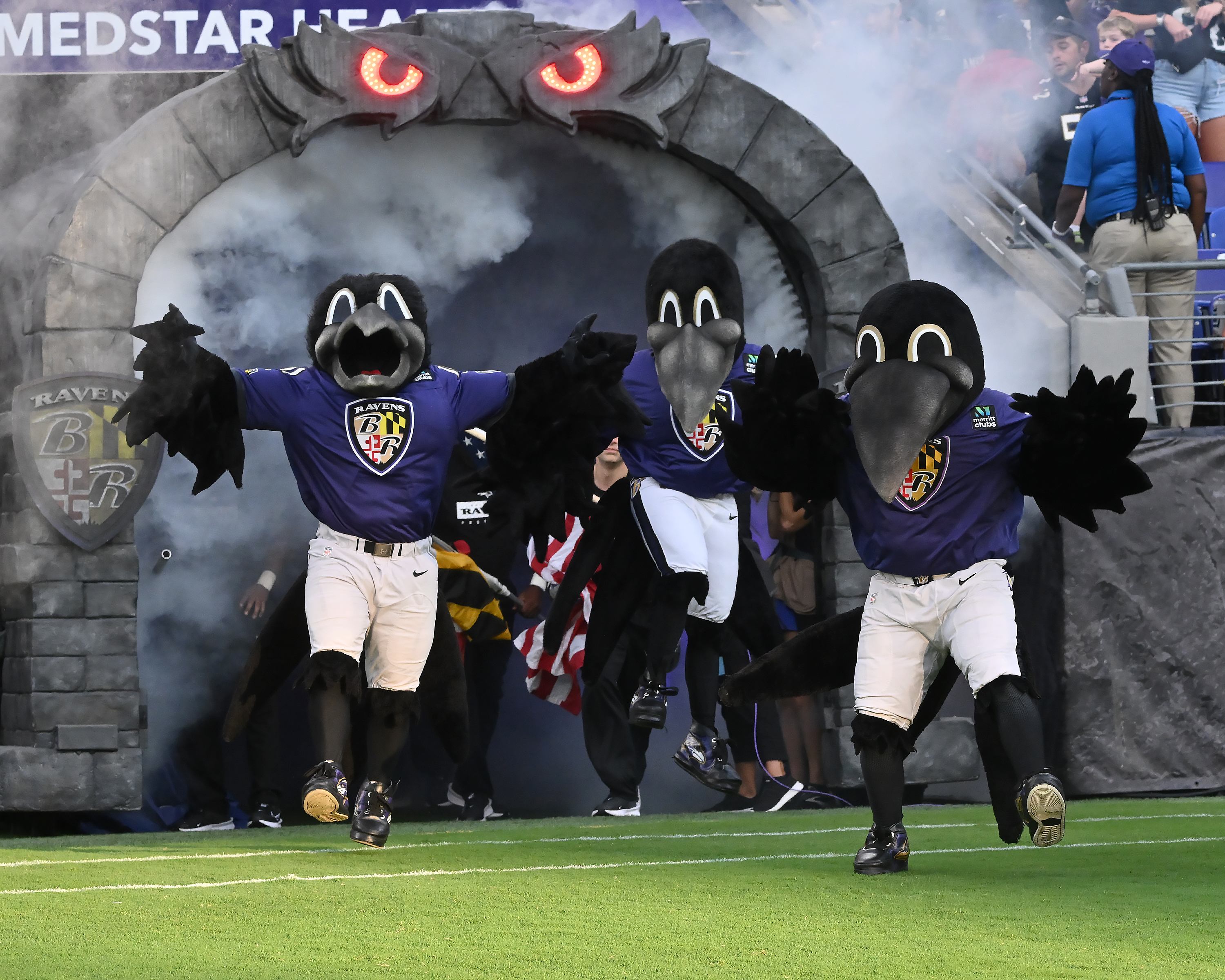 Edgar, Allan and Poe mascots on the field