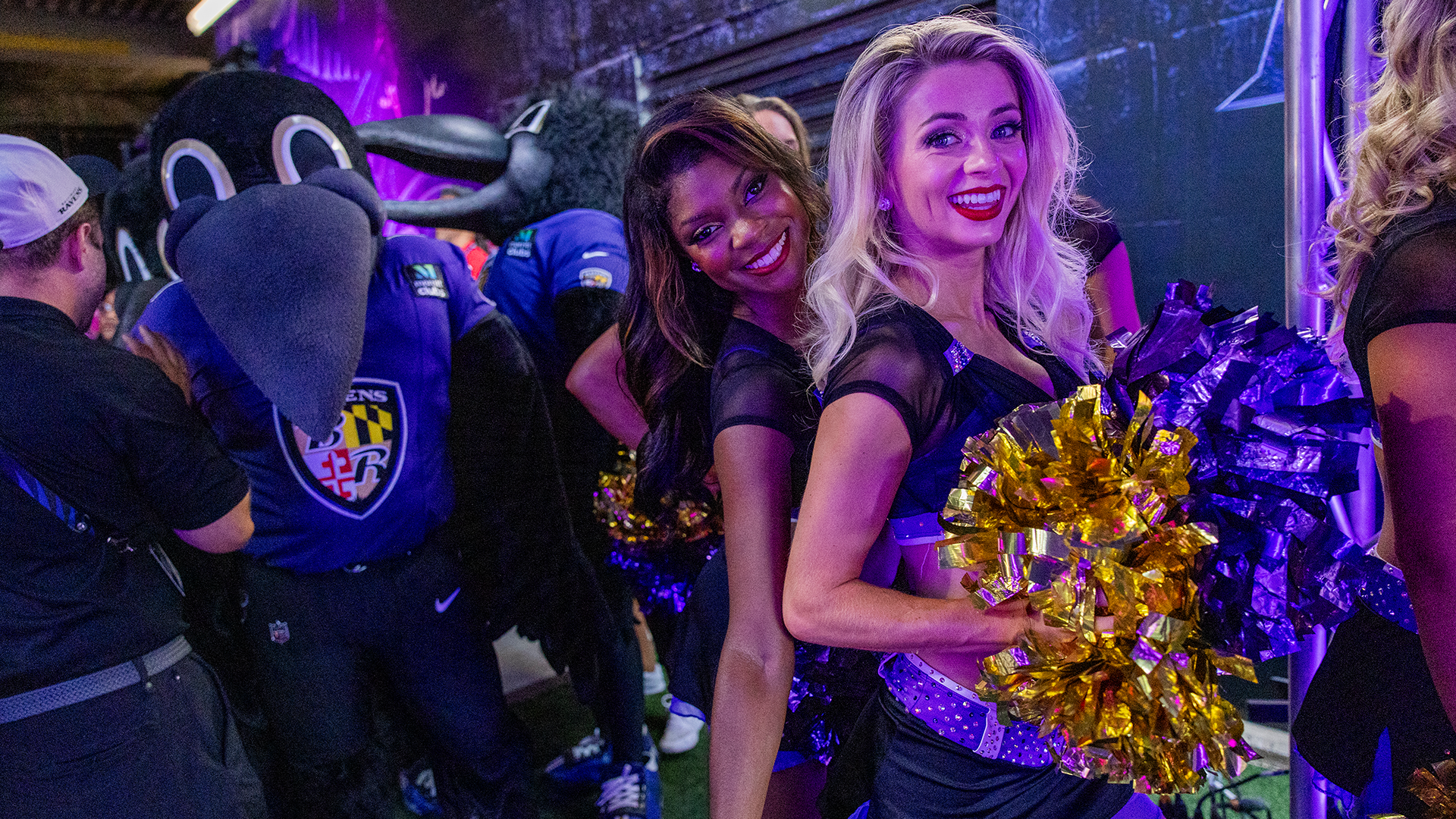 Cheer and Poe with Ravens branded vehicles