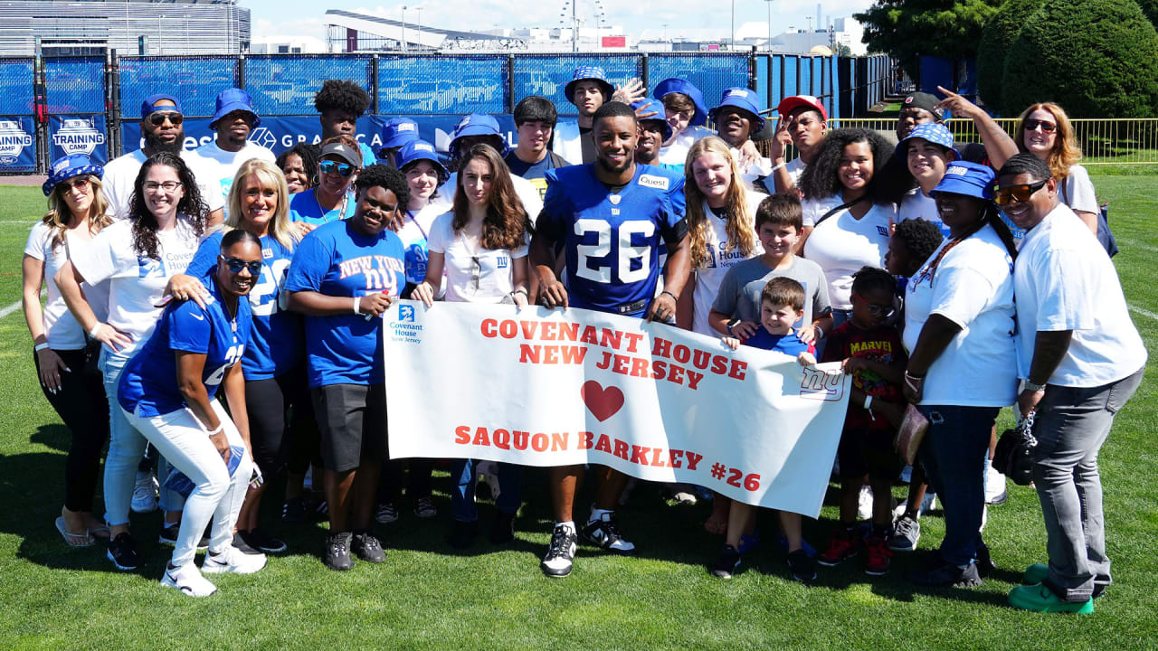 Saquon Barkley congratulating Cam Skattebo after a game