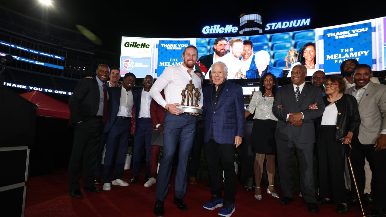 Brenden Schooler is honored after being announced as the winner of the Ron Burton Community Service Award at the 2024 Patriots Premiere