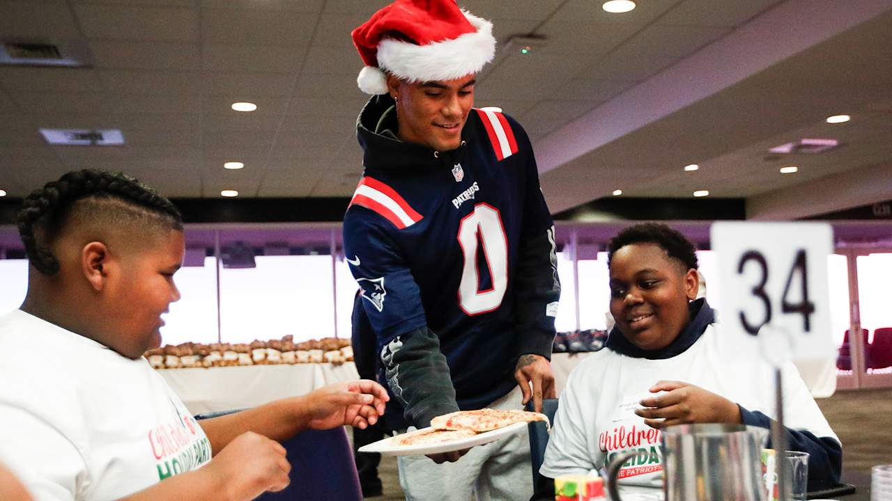 Christian Gonzalez, Hunter Henry, and Patriots teammates get in holiday spirit at community events