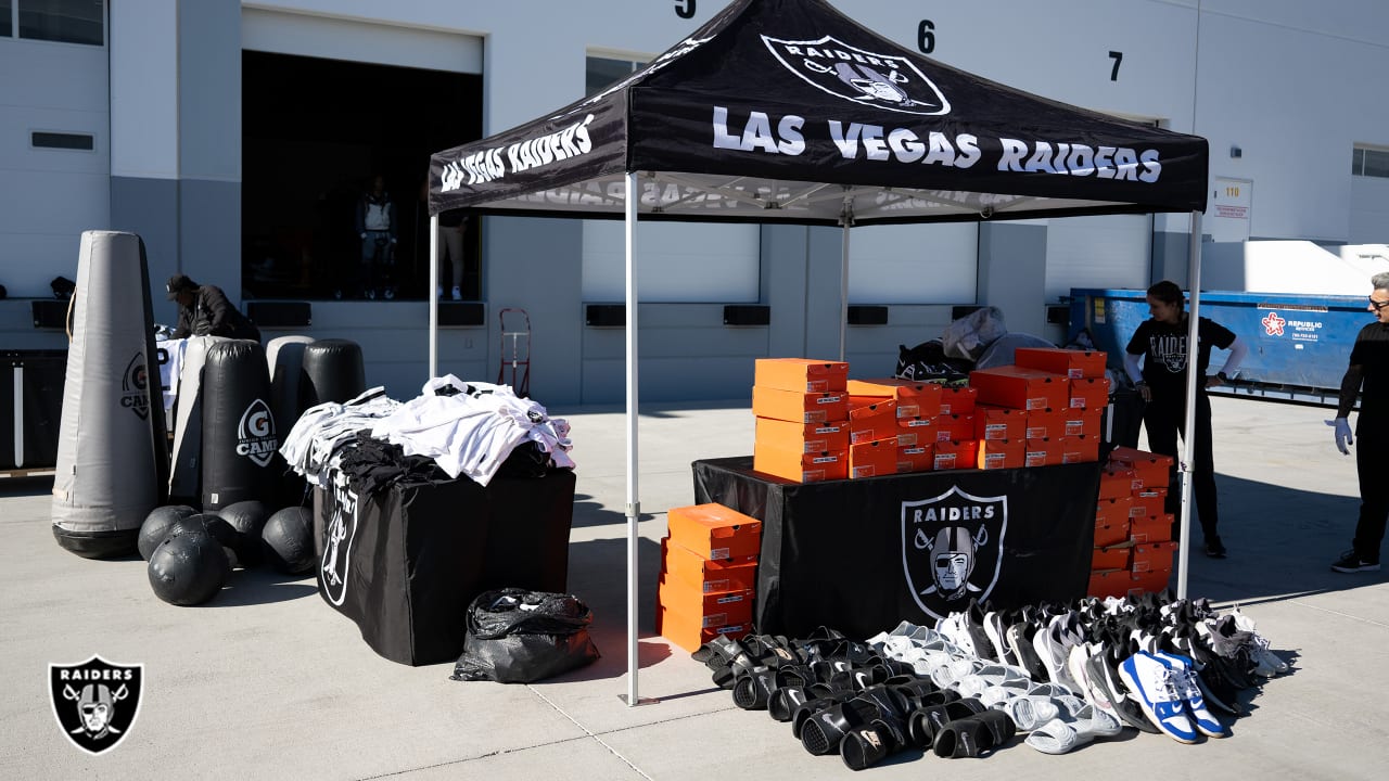 Photos: Raiders donate equipment to local football groups