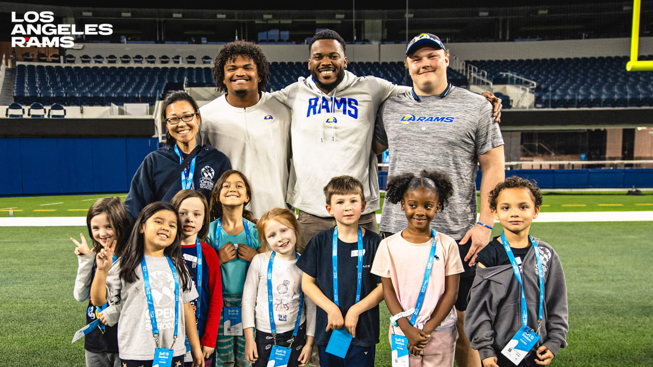 Los Angeles Rams Community Rams players take foster under resourced youth on tour of SoFi Stadium distribute gifts in partnership with ABC7 Spark of Love Toy Drive