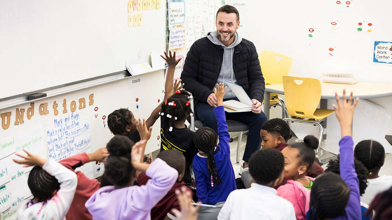Jesse Minter And Eric DeCosta Read to Maryland Kids