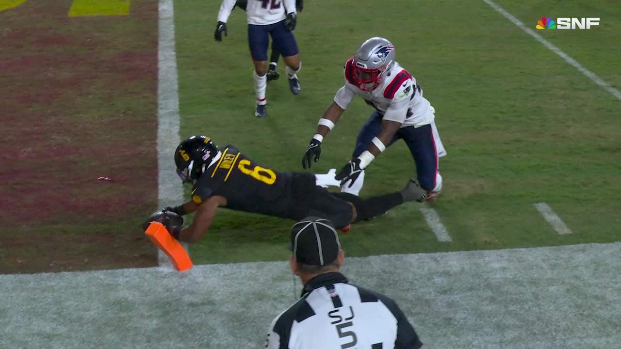 Michael Wiley's body goes parallel to ground on epic pylon-reach TD