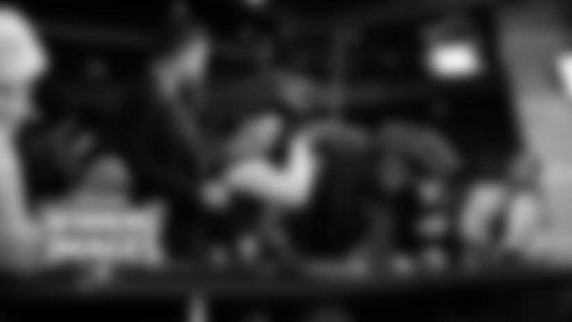 Check out the best postgame photos taken on the field and in the locker room at Soldier Field after the Bears' incredible comeback victory over the Green Bay Packers to advance to the Divisional Round.